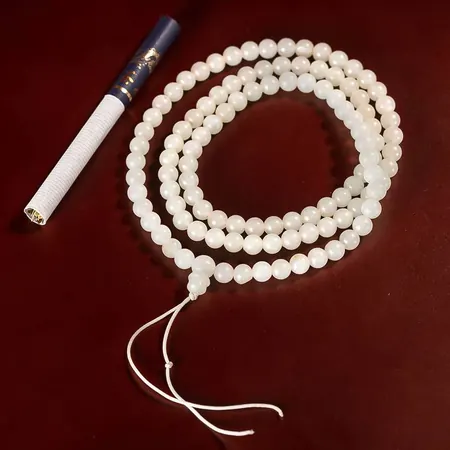 108-Bead White Hetian Jade Bracelet with Golden Skin
