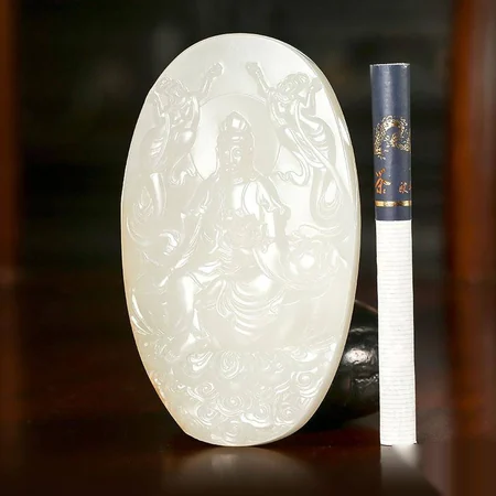 White Hetian Jade Carving: Guanyin with a Lotus, 127.4 g