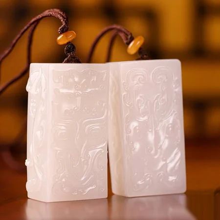 White Hetian Jade Plaque Pair: Archaistic Dragon and Phoenix