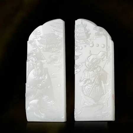 White Hetian Jade Wenqu and Wuqu Plaque Pair