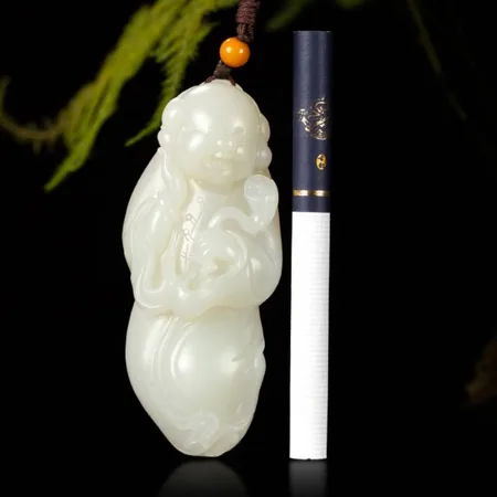 Yellow-Skin White Hetian Seed Jade Palm Carving - Boy Holding a Lotus, 67 g